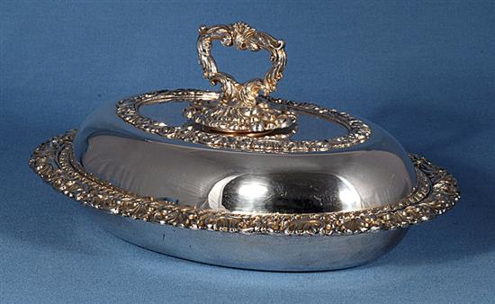 A pair of ornate Victorian oval silver plated entrée dishes with covers, length 278mm.